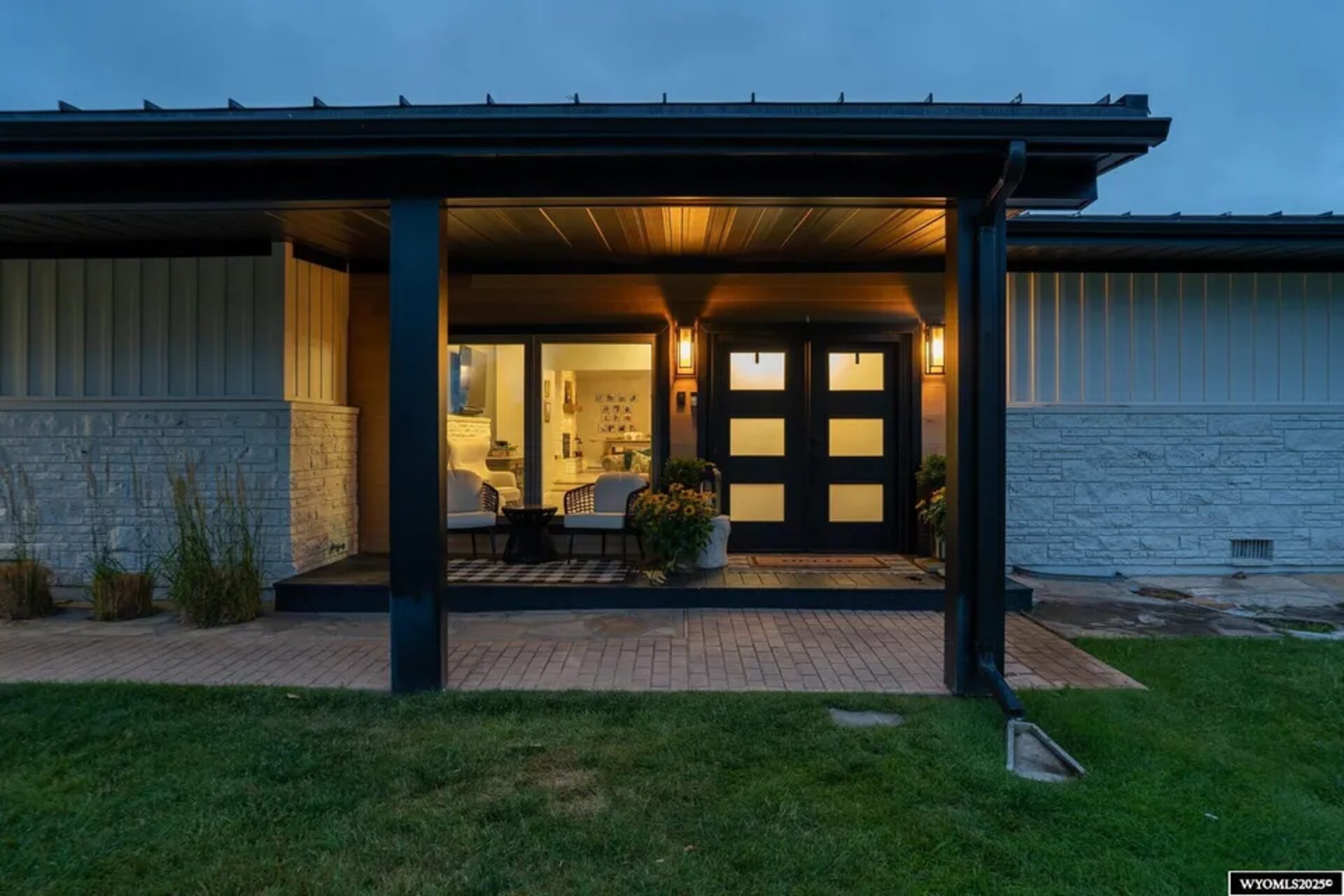 Absaraka House estate at dusk beneath the Bighorn Mountains