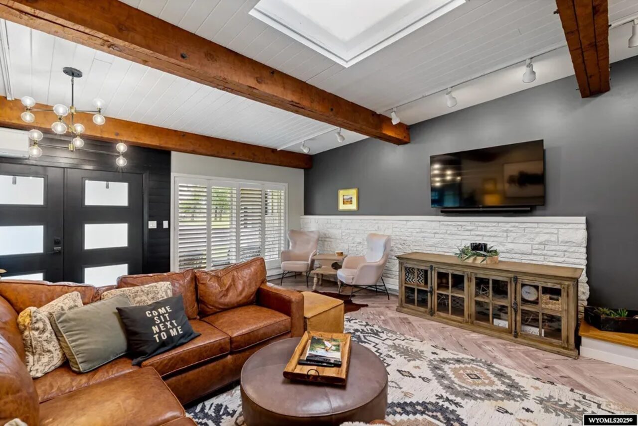 Warm living room with fireplace inside Absaraka House